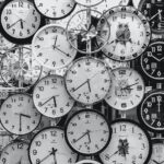 black and white photo of clocks